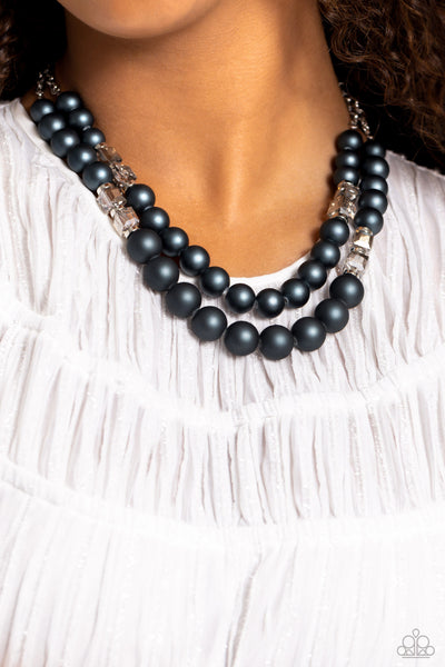 Paparazzi Shopaholic Season Necklace and Shopaholic Showdown Blue Bracelet

P9RE-BLXX-245QB
Two strands of oversized blue beads featuring a subtle shimmer, silver accents, and clear gray cubed beads stretch around the wrist, creating refined,