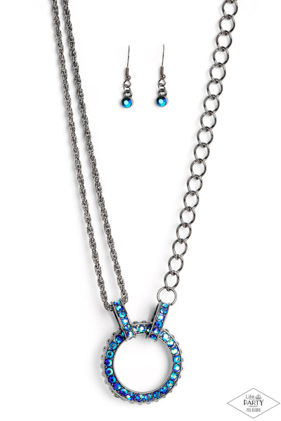 Paparazzi 
Am I GLEAMing? Multi Iridescent Ring and Razzle Dazzle UV Blue Necklace Set